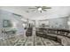 Bright living room with comfortable seating, open floor plan, and views of the adjacent kitchen at 7915 115Th E Ave, Parrish, FL 34219
