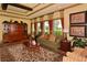 Comfortable community living room boasts neutral decor, stylish furnishings, and an abundance of natural light at 7915 115Th E Ave, Parrish, FL 34219