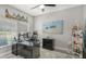 Home office boasts natural light, modern desk setup, beachy decor, and neutral color palette at 7915 115Th E Ave, Parrish, FL 34219