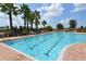 Resort-style pool area with lounge chairs and clear water on a sunny day at 7915 115Th E Ave, Parrish, FL 34219