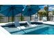 Relaxing in-ground pool features shallow lounge seating and plenty of room for entertaining outdoors at 7915 115Th E Ave, Parrish, FL 34219