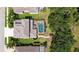 Stunning aerial view of a home featuring a screened-in pool, lush landscaping, and a private backyard oasis at 7915 Kavanagh Ct, Sarasota, FL 34240