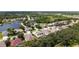 Beautiful aerial view of a residential area showcasing lush greenery, serene lakes, and well-maintained homes at 7915 Kavanagh Ct, Sarasota, FL 34240