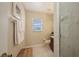 A well-lit bathroom featuring a glass-enclosed shower, window, and neutral color palette creating a clean, refreshing space at 7915 Kavanagh Ct, Sarasota, FL 34240