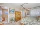Main bedroom with wood canopy bed frame and access to ensuite bathroom at 7915 Kavanagh Ct, Sarasota, FL 34240