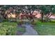 Relaxing community space with pergola, outdoor seating, and views of the golf course at 7915 Kavanagh Ct, Sarasota, FL 34240