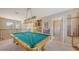 Game room with a classic pool table, wet bar, and access to the bathroom at 7915 Kavanagh Ct, Sarasota, FL 34240