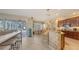 Bright kitchen open to the eating nook and outdoor living space, featuring tiled floors at 7915 Kavanagh Ct, Sarasota, FL 34240