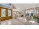 Open concept living room and dining room area with grand entrance at 7915 Kavanagh Ct, Sarasota, FL 34240