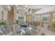 Cozy living room and dining room area with grand staircase at 7915 Kavanagh Ct, Sarasota, FL 34240