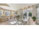 Cozy living room and dining room area filled with natural light at 7915 Kavanagh Ct, Sarasota, FL 34240