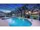 Enjoy the screened pool with spa, views of the golf course, and the natural sunset views at 7915 Kavanagh Ct, Sarasota, FL 34240
