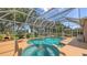 The inviting screened-in pool and hot tub offer a tranquil escape in a private outdoor space at 7915 Kavanagh Ct, Sarasota, FL 34240