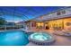 Screened pool features a spa with fountain, outdoor dining areas, and a built-in grill at 7915 Kavanagh Ct, Sarasota, FL 34240