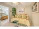 Sitting room adjacent to main bedroom with couch and glass table at 7915 Kavanagh Ct, Sarasota, FL 34240