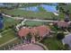 Aerial view of a beautiful home with a golf course in the background at 10054 Crooked Creek Dr # 201, Venice, FL 34293