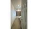 Hallway bathroom showing a tub with tile surround, toilet and vanity with light cabinets at 10054 Crooked Creek Dr # 201, Venice, FL 34293