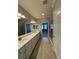 Bathroom featuring double sinks, tiled floors, and walk-in shower at 10054 Crooked Creek Dr # 201, Venice, FL 34293