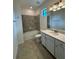 Bathroom with tiled shower and tub combination and a vanity at 10054 Crooked Creek Dr # 201, Venice, FL 34293