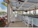 Community bar with outdoor seating with views of the swimming pool at 10054 Crooked Creek Dr # 201, Venice, FL 34293