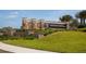 Stone monument marking the entrance to Sarasota National with lush landscaping at 10054 Crooked Creek Dr # 201, Venice, FL 34293