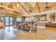 Community room with many tables and chairs, cofffee bar, and high ceilings at 10054 Crooked Creek Dr # 201, Venice, FL 34293