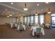 Dining room featuring tables set with white tablecloths at 10054 Crooked Creek Dr # 201, Venice, FL 34293