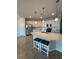 Bright kitchen boasts stainless steel appliances, white cabinets, and a large island with seating at 10054 Crooked Creek Dr # 201, Venice, FL 34293