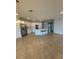 Open kitchen featuring stainless steel appliances, kitchen island with sink and lots of cabinet space at 10054 Crooked Creek Dr # 201, Venice, FL 34293