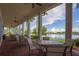 Outdoor seating area with views of the community lake and golf course at 10054 Crooked Creek Dr # 201, Venice, FL 34293