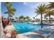 Stunning community pool with clear blue water and comfortable lounge seating at 10054 Crooked Creek Dr # 201, Venice, FL 34293