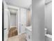 Bathroom features a sink and door leading to a hallway at 10443 Riverside Rd, Port Charlotte, FL 33981