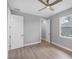 Bedroom featuring a ceiling fan and window at 10443 Riverside Rd, Port Charlotte, FL 33981