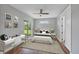 Bedroom featuring wood floors, a ceiling fan, a sliding glass door, and a closet at 10443 Riverside Rd, Port Charlotte, FL 33981