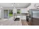 Kitchen with marble counters, an island with sink and stainless steel appliances at 10443 Riverside Rd, Port Charlotte, FL 33981