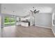 Open floor plan with luxury vinyl plank flooring and kitchen island offers plenty of space to relax at 10443 Riverside Rd, Port Charlotte, FL 33981