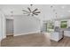 Spacious living room features an open floor plan, vaulted ceilings, and luxury vinyl plank flooring at 10443 Riverside Rd, Port Charlotte, FL 33981