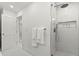 Bathroom with a glass-enclosed shower featuring tiled walls and a recessed shelf at 1051 Indian Beach Dr, Sarasota, FL 34234
