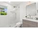 Bathroom showcasing a glass shower and a vanity with stylish hardware at 1051 Indian Beach Dr, Sarasota, FL 34234