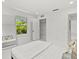 White bedroom featuring a closet, and a large window that looks out onto lush greenery at 1051 Indian Beach Dr, Sarasota, FL 34234