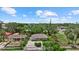 Charming home with beautiful landscaping, a cozy front porch, and a well-maintained yard, nestled among mature trees at 1051 Indian Beach Dr, Sarasota, FL 34234