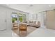 Inviting living room with large windows, comfortable seating, and stylish decor, creating a cozy atmosphere at 1051 Indian Beach Dr, Sarasota, FL 34234