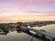 Breathtaking aerial view of the bridge over the water showing the ocean with an colorful sunset at 107 Clipper Way # 107, Nokomis, FL 34275