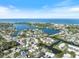 Stunning aerial view of a waterfront community and the beautiful ocean in the distance at 107 Clipper Way # 107, Nokomis, FL 34275