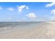 Beautiful view of a sandy beach with gentle waves lapping the shore at 107 Clipper Way # 107, Nokomis, FL 34275