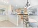 Charming kitchen featuring updated cabinets, granite counters and stainless appliances at 107 Clipper Way # 107, Nokomis, FL 34275