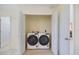 Convenient laundry closet with washer and dryer hookups and shelving at 107 Clipper Way # 107, Nokomis, FL 34275