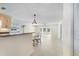 Bright living room featuring tile floors, a modern ceiling fan and eat-in bar with modern pendant lighting at 107 Clipper Way # 107, Nokomis, FL 34275