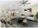 Open concept living room with modern decor flowing into the kitchen area at 107 Clipper Way # 107, Nokomis, FL 34275