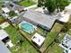 Aerial view showcasing the property's pool, backyard fire pit, shed, and overall serene outdoor living at 111 66Th Street E Ct, Bradenton, FL 34208